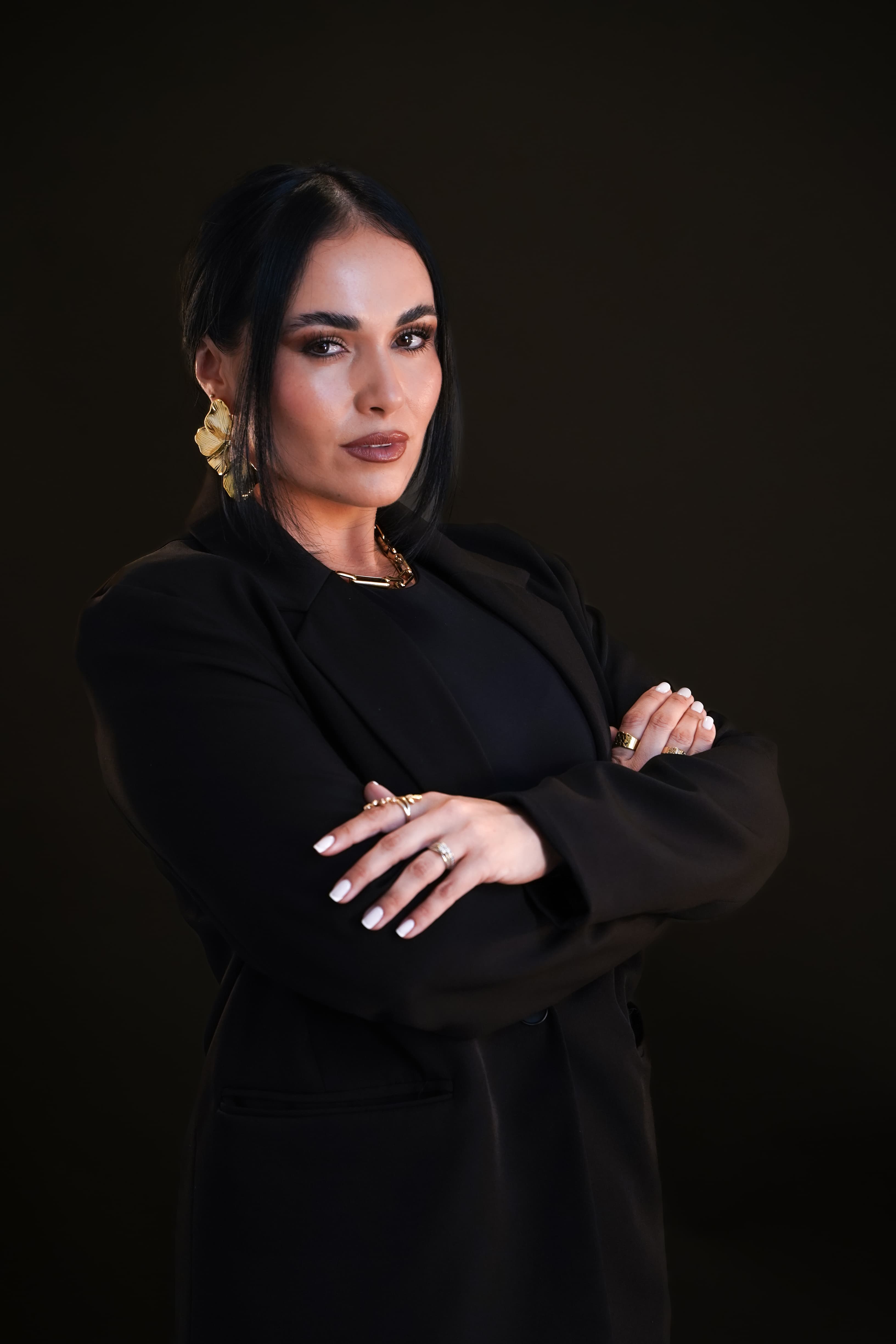 Dr. Gissele Donovan — black blazer, arms crossed