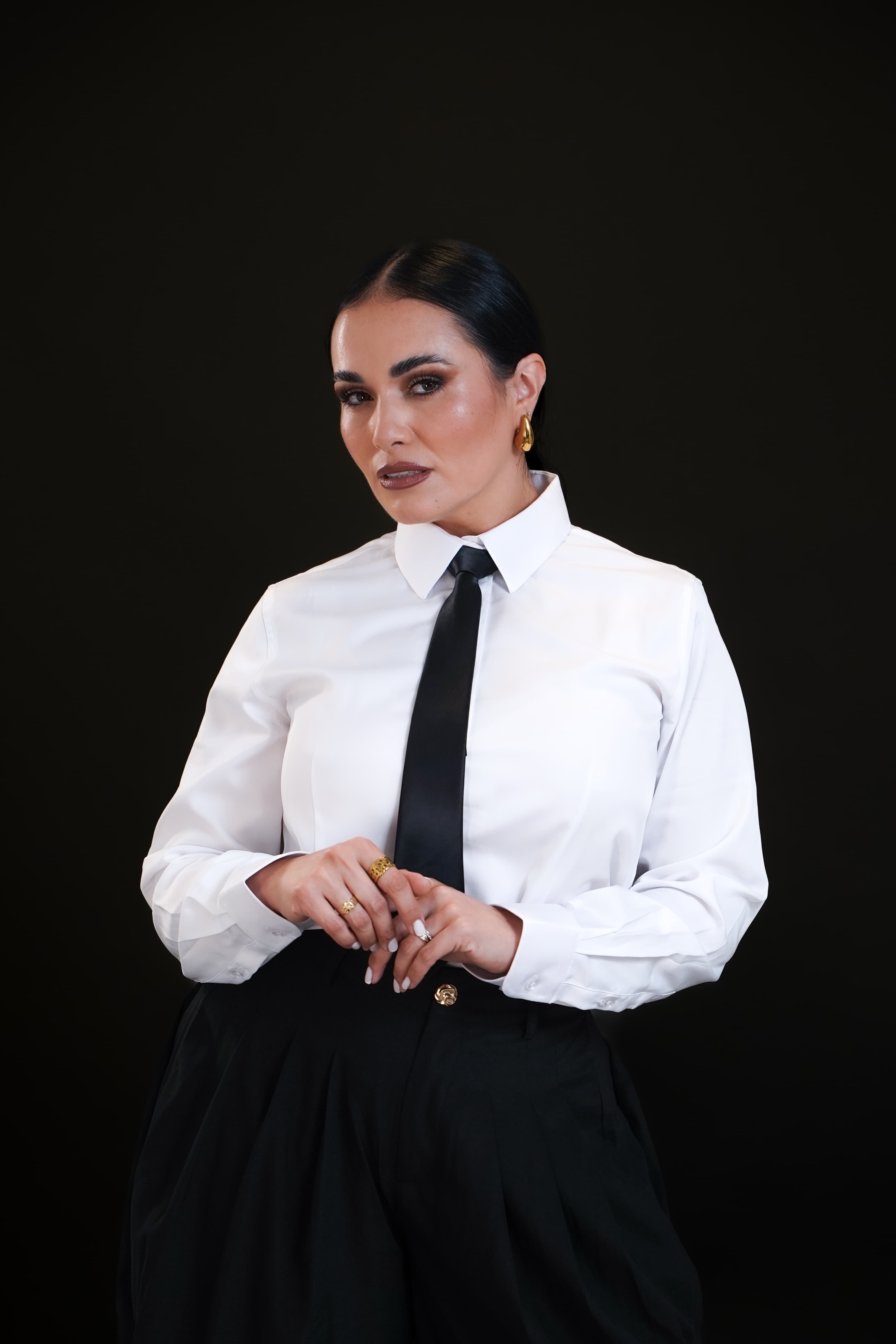 Dr. Gissele Donovan — editorial portrait, white shirt and tie